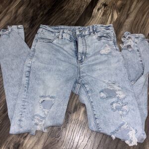 Women’s American Eagle Jeans Sz 4 Skinny Style classic blue ripped